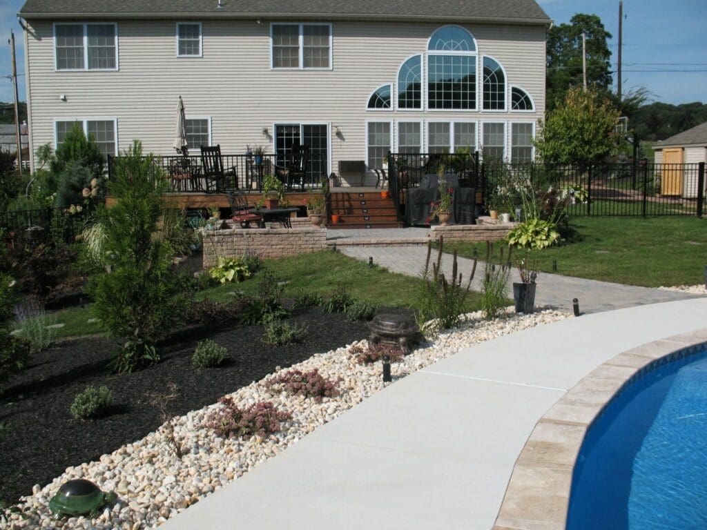 outdoor living space with pool behind house