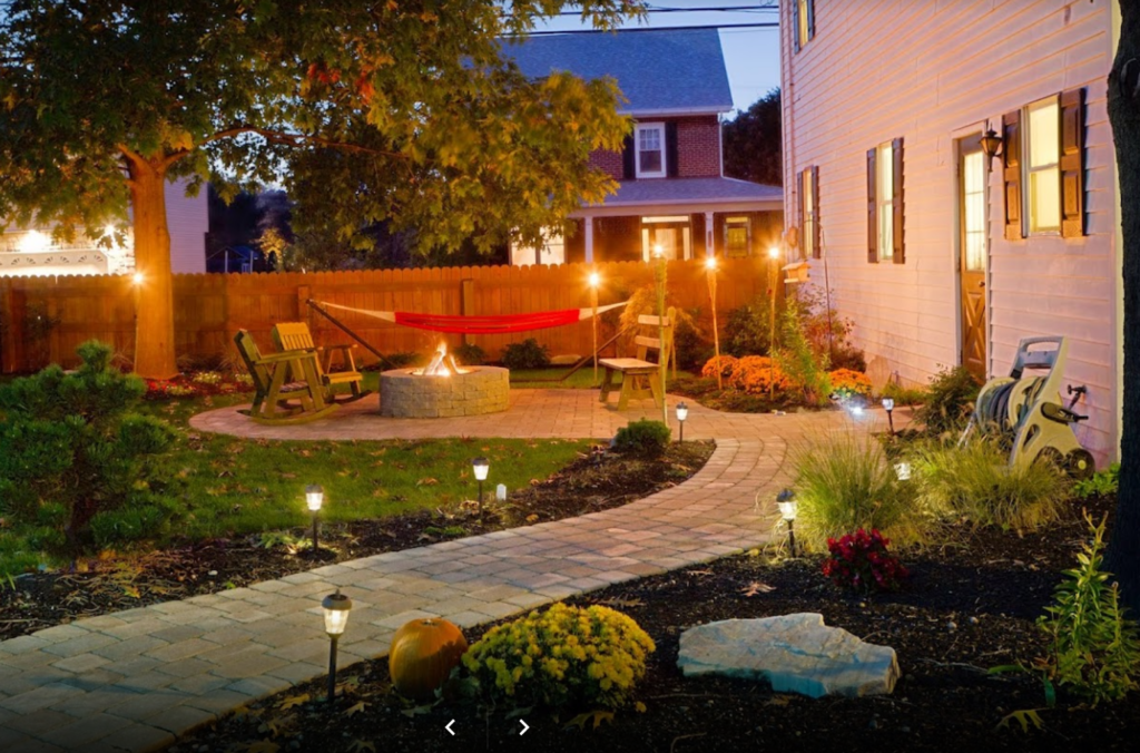 paver patio and walkways with firepit and seating and built in lighting