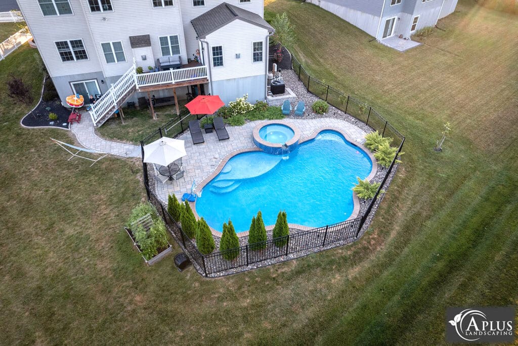 aerial view of pool behind house