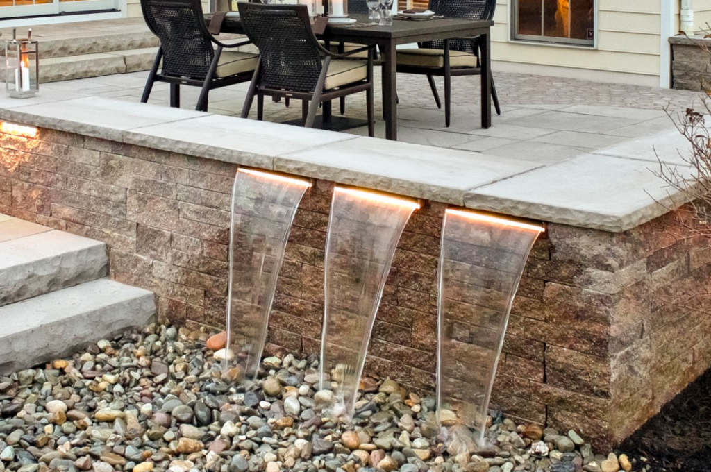 waterfall feature off retaining wall and patio