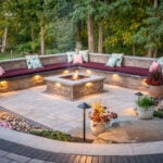 Built in seating on patio highlighting lighting and fire pit