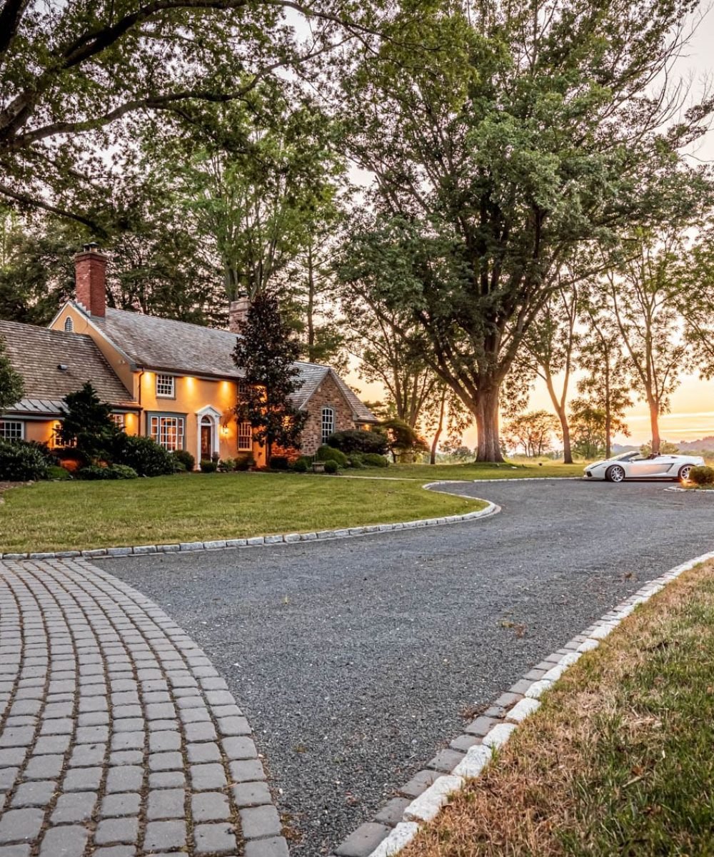 large driveway and house with two cars