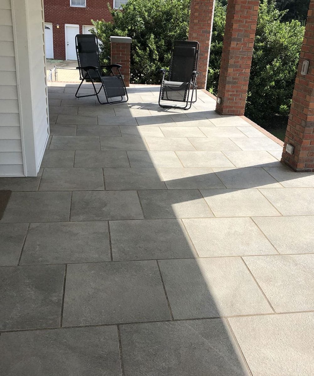 Custom stone deck with lounge chairs, A Plus Landscaping project in Reinholds, PA